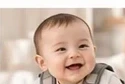 Happy baby wearing the vest